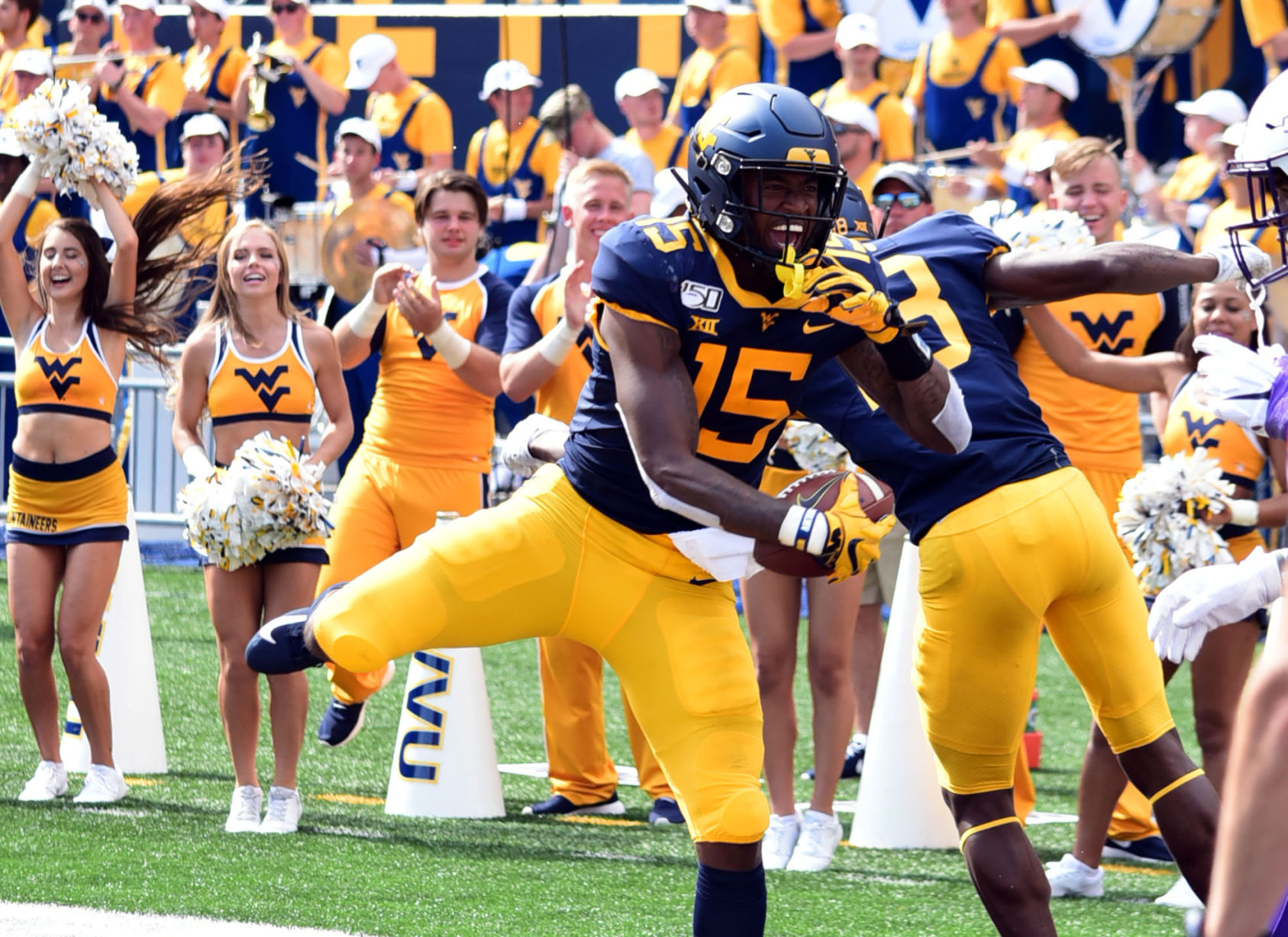 West Virginia wide receiver George Campbell celebrates his touchdown with a teammate.